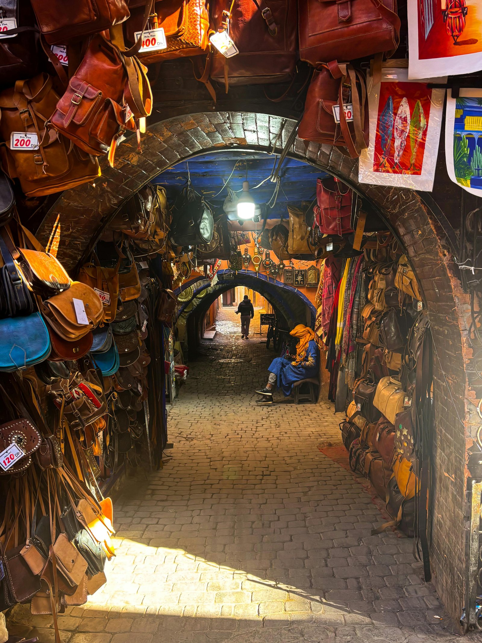 Vibrant Moroccan medina with colorful spice stalls and lanterns